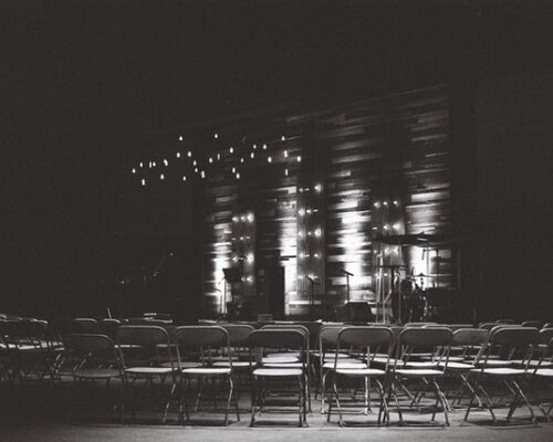 conference hall pictured in black and white